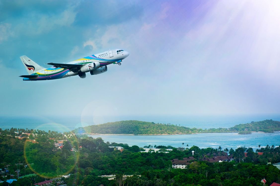 A passenger jet climbing into the sky after take-off, representing the airline English test cabin crew candidates prepare for