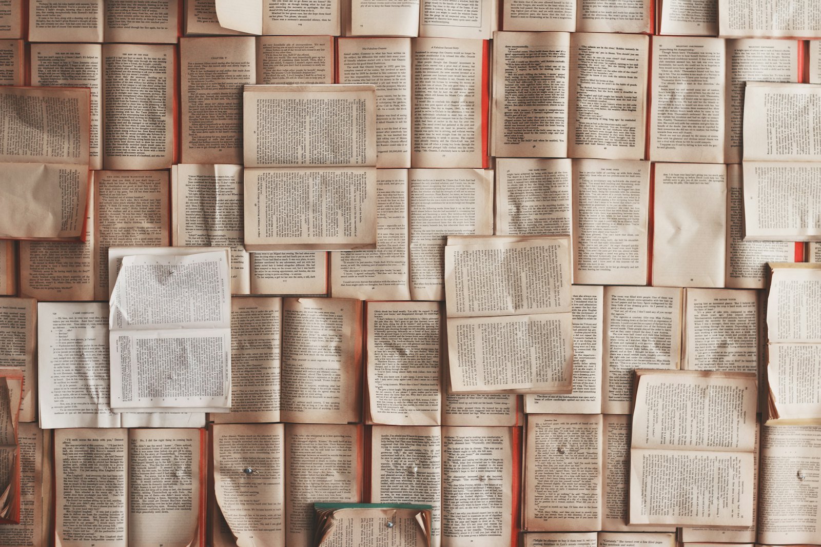Stack of English books and a dictionary on a desk, ready for vocabulary study