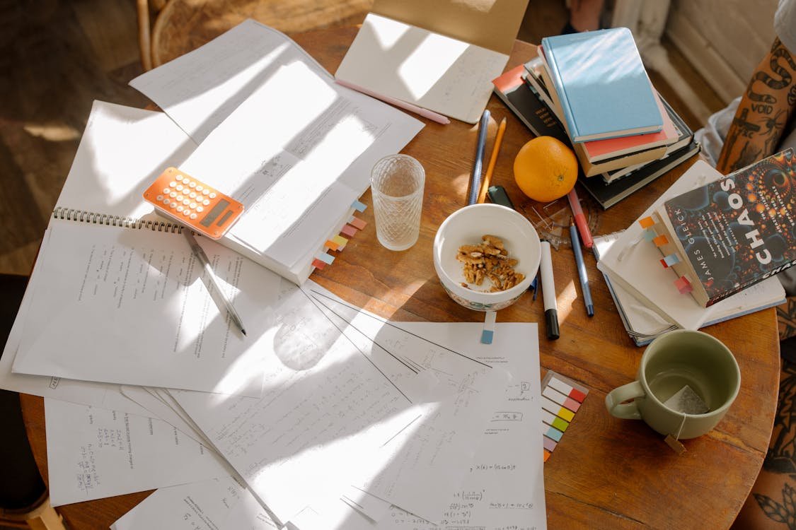 A student writing carefully during an IELTS exam